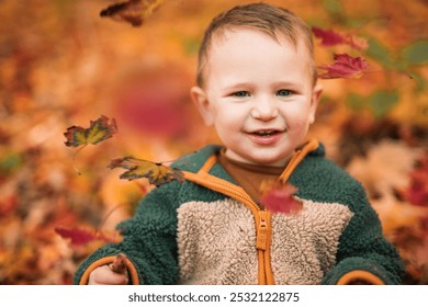 A baby boy having fun on Autumn Forest - Powered by Shutterstock