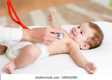 Baby boy having it's heartbeat checked by doctor pediatrist - Powered by Shutterstock