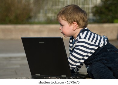 Baby Boy With Laptop Outside