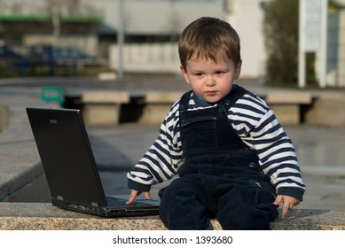 Baby Boy With Laptop Outside