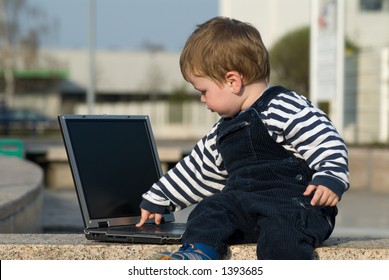 Baby Boy With Laptop Outside