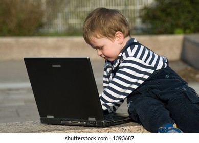 Baby Boy With Laptop Outside