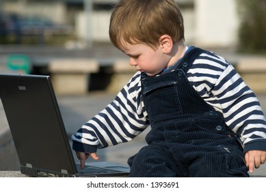 Baby Boy With Laptop Outside