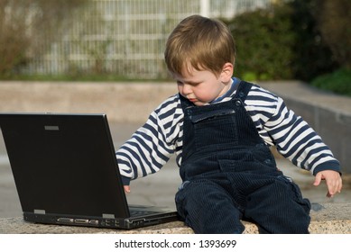 Baby Boy With Laptop Outside