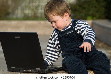 Baby Boy With Laptop Outside