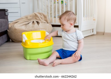 Baby Boy Learning How To Use Chamber Pot