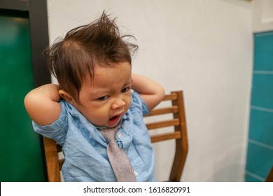 A Baby Boy With Messy Hair Wearing Smart Attire, With Many Facial Expressions