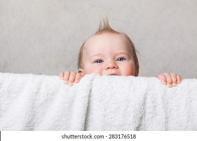 Baby Boy With A Mohawk Haircut Peeking Out Of The Crib