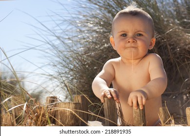 Baby Boy On A Sand Dune Drooling