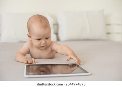 baby boy playing with digital tablet isolated on white - Powered by Shutterstock