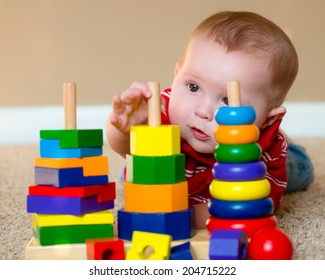 Baby Boy Playing With Stacking Learning Toy