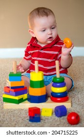 Baby Boy Playing With Stacking Learning Toy