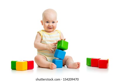 Baby Boy Plays With Building Blocks