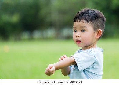 Baby Boy Scratching His Arm