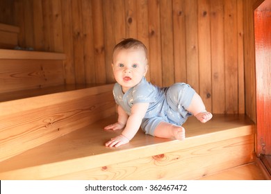 Baby Boy Sitting And Climbing Up Stairs.