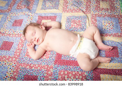 Baby Boy Sleeping On Back On Blanket