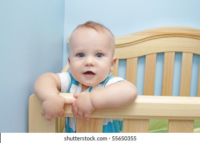 Baby Boy Standing In Crib, Smiling