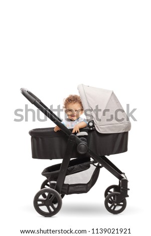 Baby boy in a stroller isolated on white background