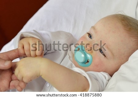 Similar – Baby asleep while parents caress