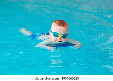 Baby boy swims independently in the pool