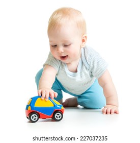 Baby Boy Toddler Playing With Toy Car Isolated