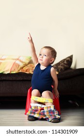 Baby Boy Toddler Sitting On The Potty