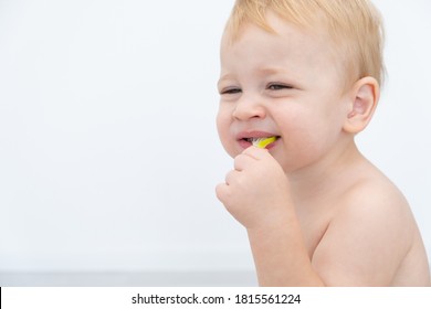 Baby Boy Trying And Tasting New Food. Dieting, Vegetarian And Healthy Nutrition Concept.