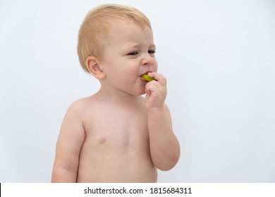 Baby Boy Trying And Tasting New Food. Dieting, Vegetarian And Healthy Nutrition Concept.