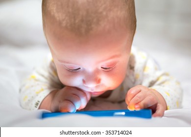 Baby Boy Watching Movie On The Mobile Phone