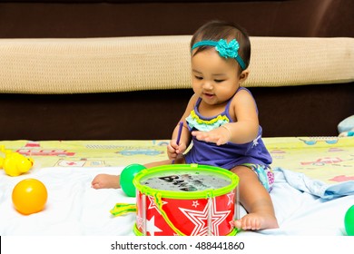 Baby Brothers Playing Drums At Home.