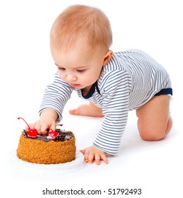 Baby and cake. Isolated on white background