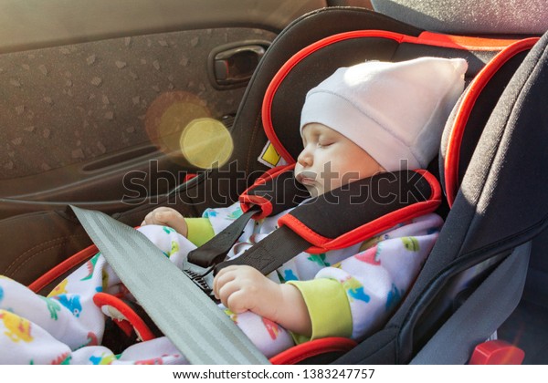 baby in the car, the\
concept of safe transportation of children in the car seat, seat\
belts, safe movement