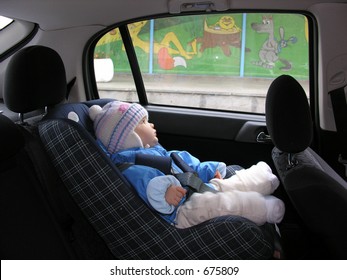 Baby In Car With Dreams In Window