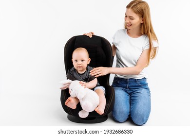 Baby In Baby Car Seat, With Mom On Isolated White Background