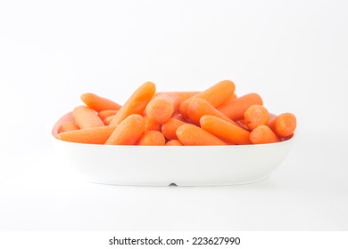 Baby Carrots In Bowl On White Background