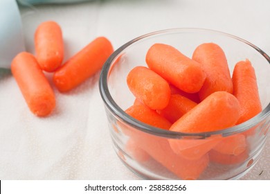 Baby Carrots In On A Table And In A Glass Bowl