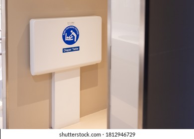 Baby Changing Station In Public Toilet Room. Diaper Table.