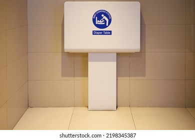 Baby Changing Station In Public Toilet Room For Traveller. Clean Foldable Diaper Table.