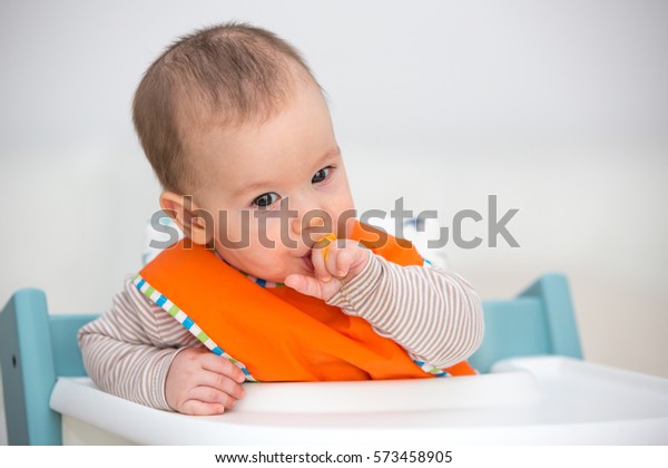 Baby Chewing On His Hands 6 Stock Photo (Edit Now) 573458905