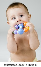 Baby Chewing On Toy