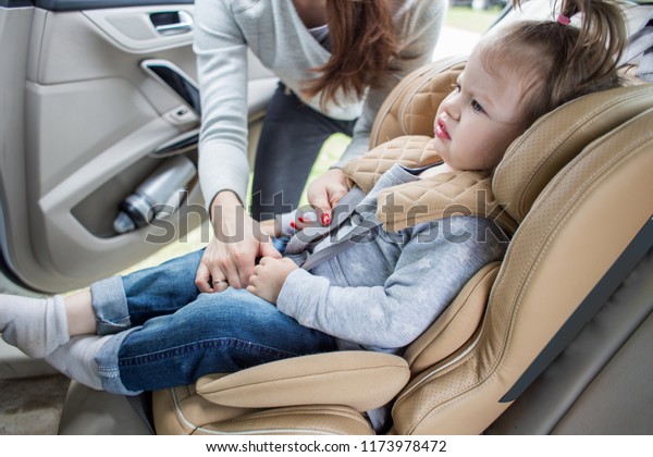 Baby in a child car seat. safe transportation of\
children. family travels