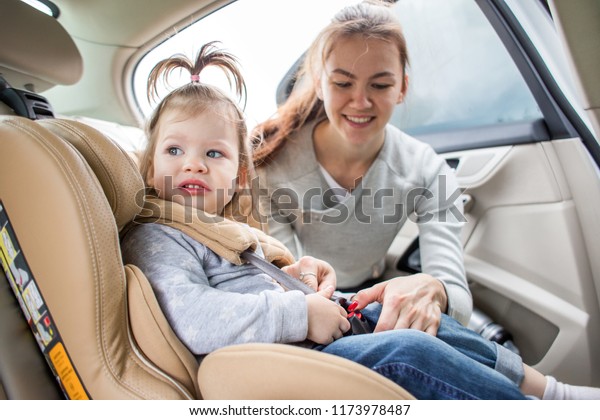 Baby in a child car seat. safe transportation of
children. family travels