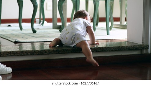 
Baby Climbing Down Step For First Time. Toddler Infant Learning To Climb Down Stair By Himself, Effortful Infant Development