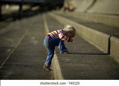 Baby Climbing Up Stone Steps