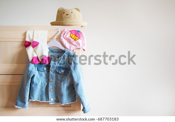 Baby Clothes Hanging On Dresser Stock Photo Edit Now 687703183