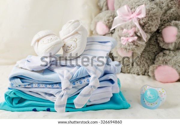 Baby clothes for\
newborn. In pastel colors