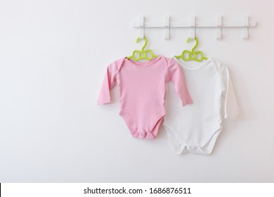 Baby Clothes On A Hanger. Place For Text, Minimalism.
