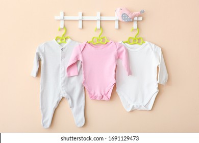 Baby Clothes On A Hanger. Place For Text, Minimalism.
