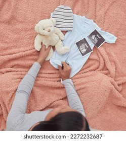Baby clothes, scan and pregnant woman preparing for her child or infant in the nursery or bedroom. Pregnancy, love and maternal female looking at a teddy bear, outfit and xray of newborn kid at home.