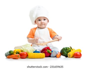 Baby Cook With Fresh Vegetables Isolated On A White